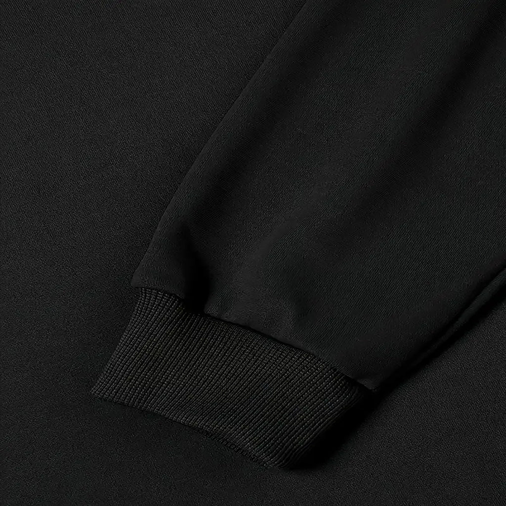 Close-up of the ribbed cuff and hem on the black Northern Light Graphic Hoodie