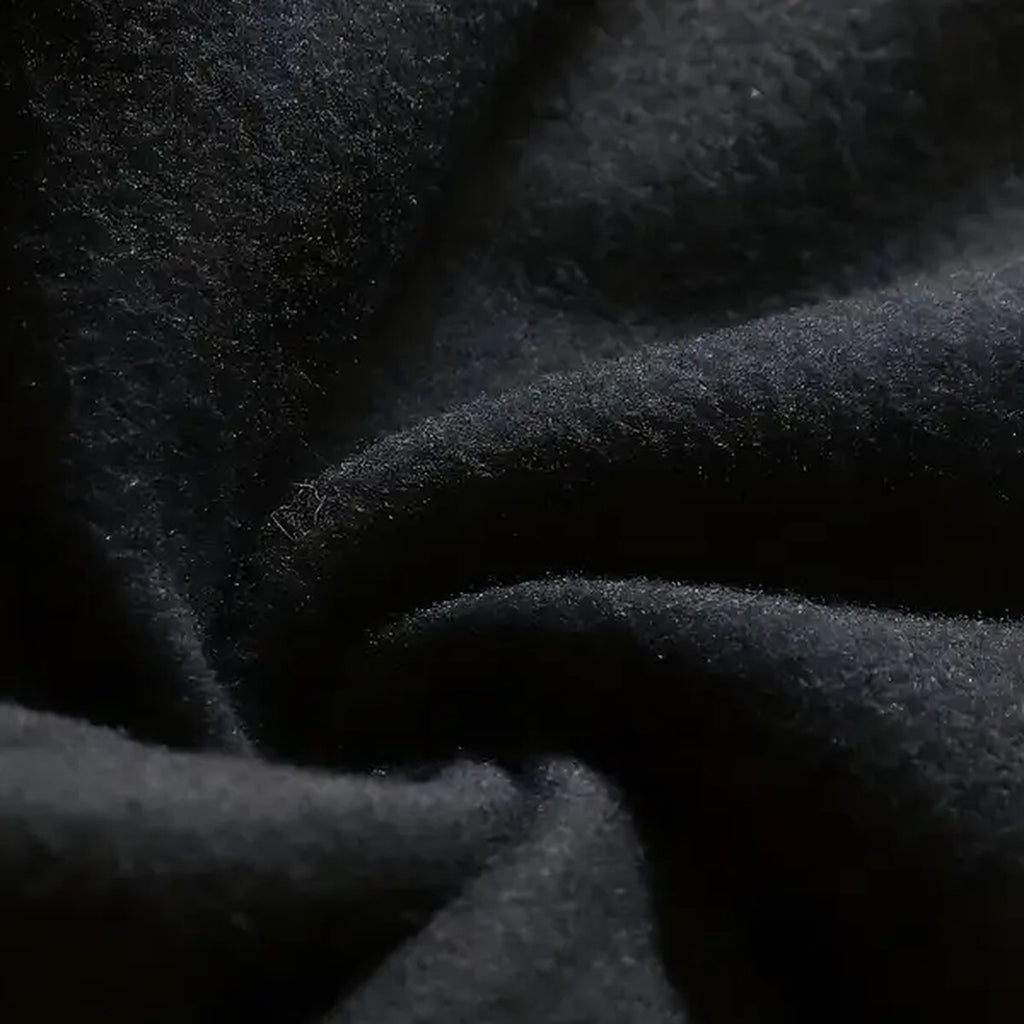 Close-up of the black Light In The Dark Graphic Hoodie fabric texture