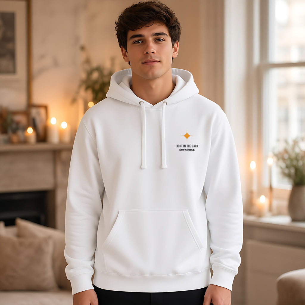 Model wearing the Light In The Dark hoodie in white, front view