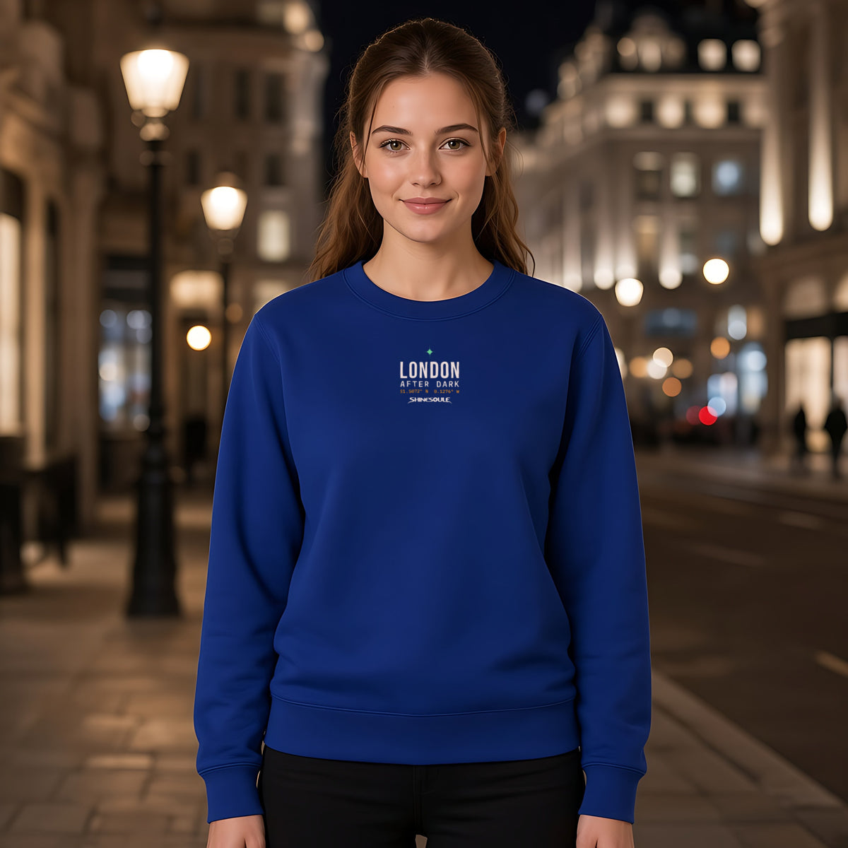 Model wearing the London After Dark crewneck sweatshirt in cobalt blue, front view