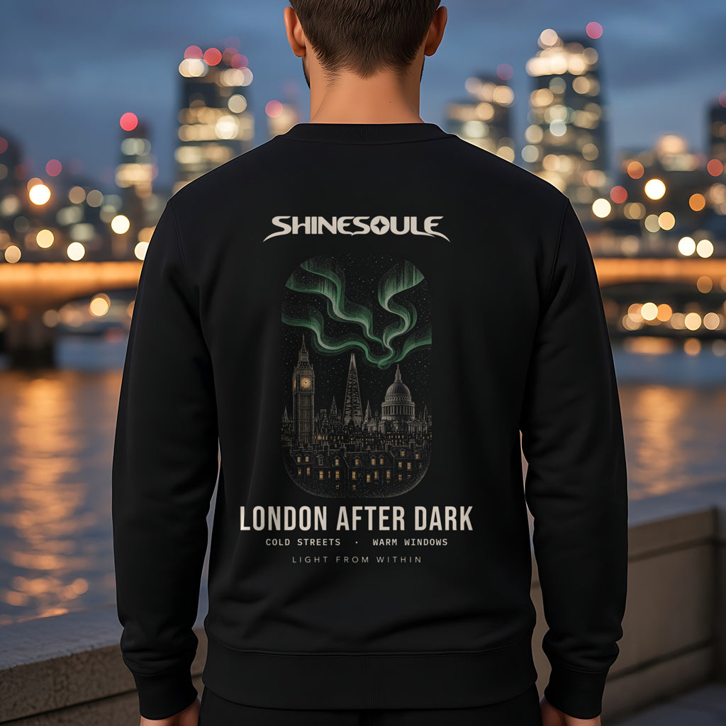 Model wearing the London After Dark crewneck sweatshirt in black, back view showing the LONDON AFTER DARK print