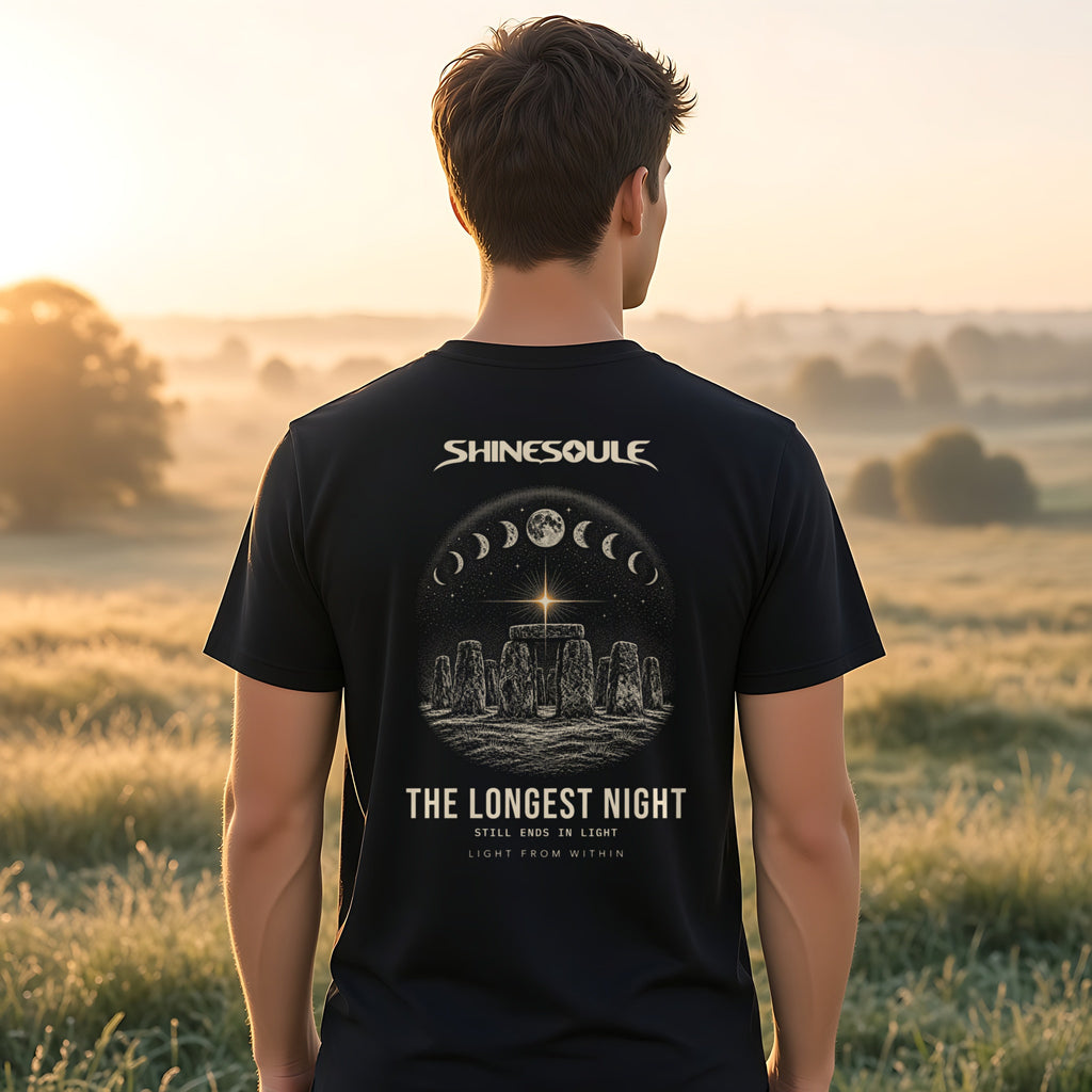 Model wearing the Solstice T-shirt in black, back view showing the THE LONGEST NIGHT print