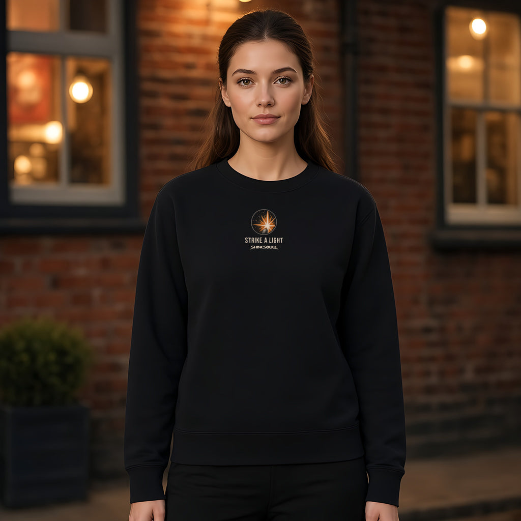Model wearing the Strike A Light crewneck sweatshirt in black, front view