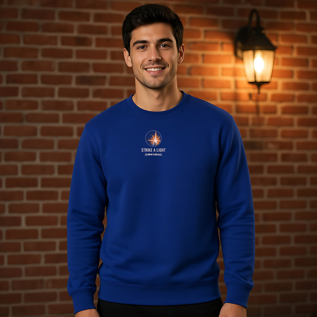 Model wearing the Strike A Light crewneck sweatshirt in cobalt blue, front view