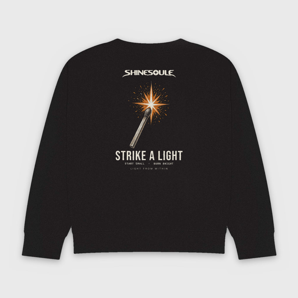 Black Strike A Light Graphic Crewneck Sweatshirt back view with struck-match STRIKE A LIGHT back print