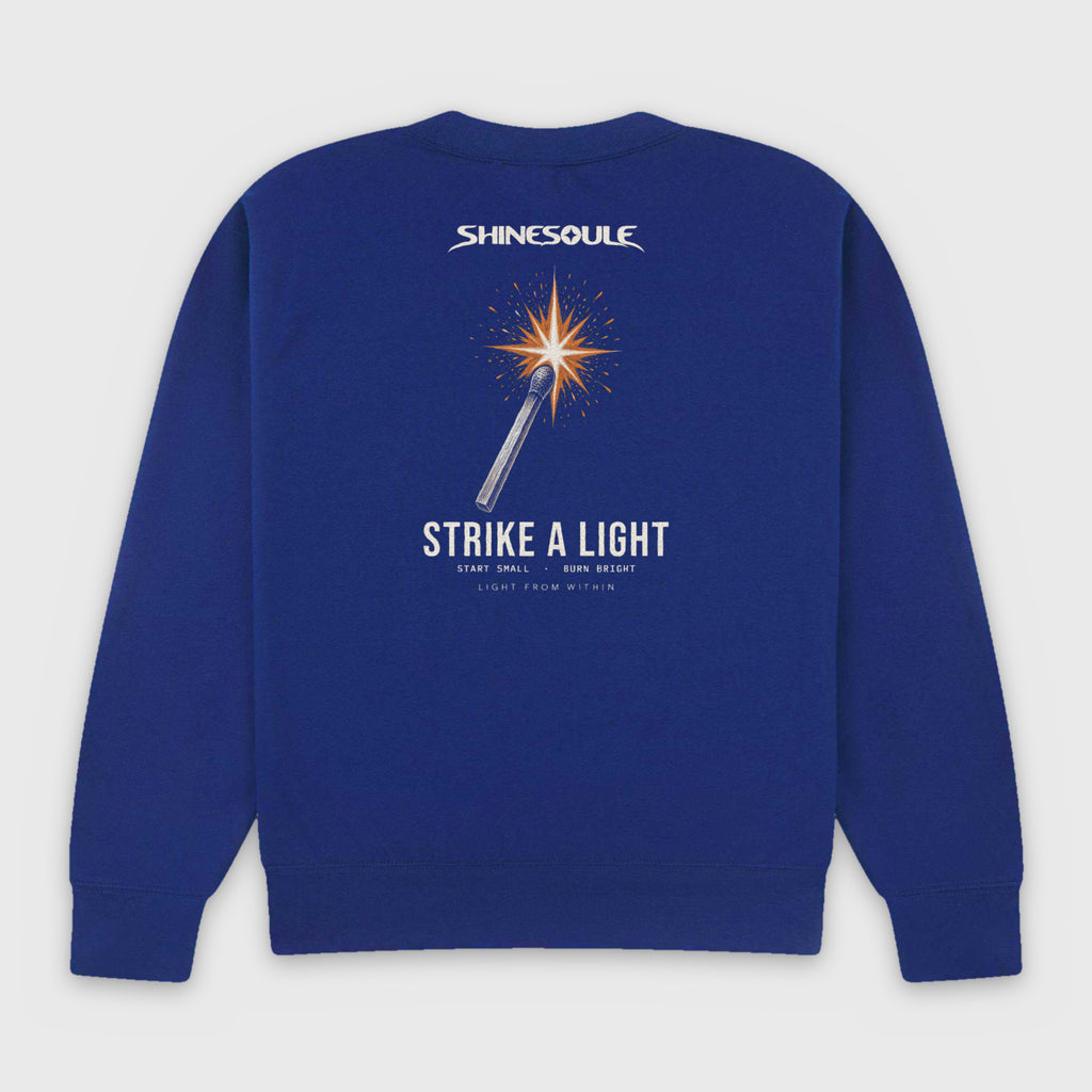 Cobalt Blue Strike A Light Graphic Crewneck Sweatshirt back view with struck-match STRIKE A LIGHT back print